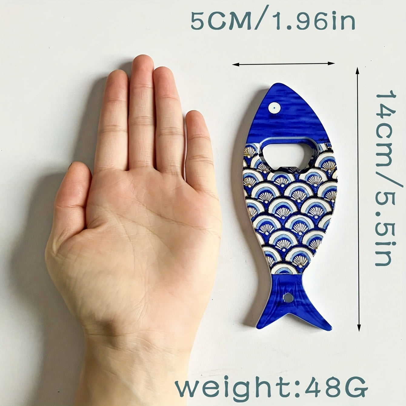 Fish-shaped cap opener with magnet for refrigerator decoration, no power required.