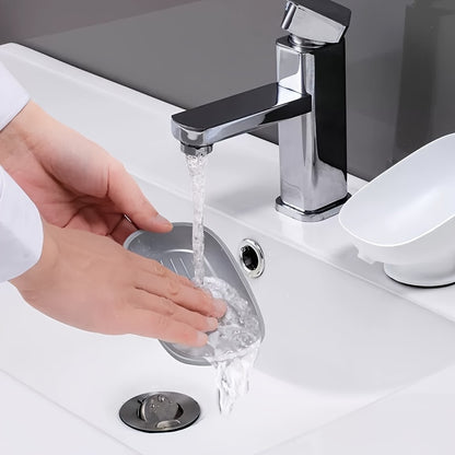 Suction cup soap dish with drainage for bathroom and kitchen sink storage.