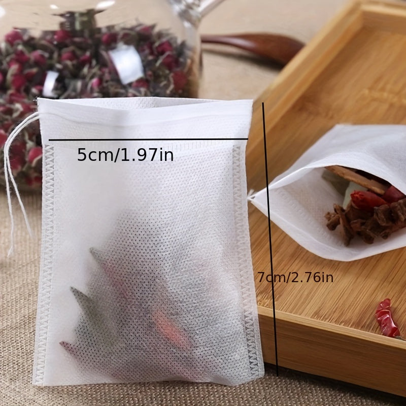 Bundle of 100 High-Quality Non-Woven Tea Infusers with Convenient Drawstring - Great for Brewing Loose Leaf Tea, Coffee, and Herbal Soups on the Go. Simple to Fill and Dispose, Leak-Proof and Odor-Free, Perfect for Making Custom Scented Teas and Spices.