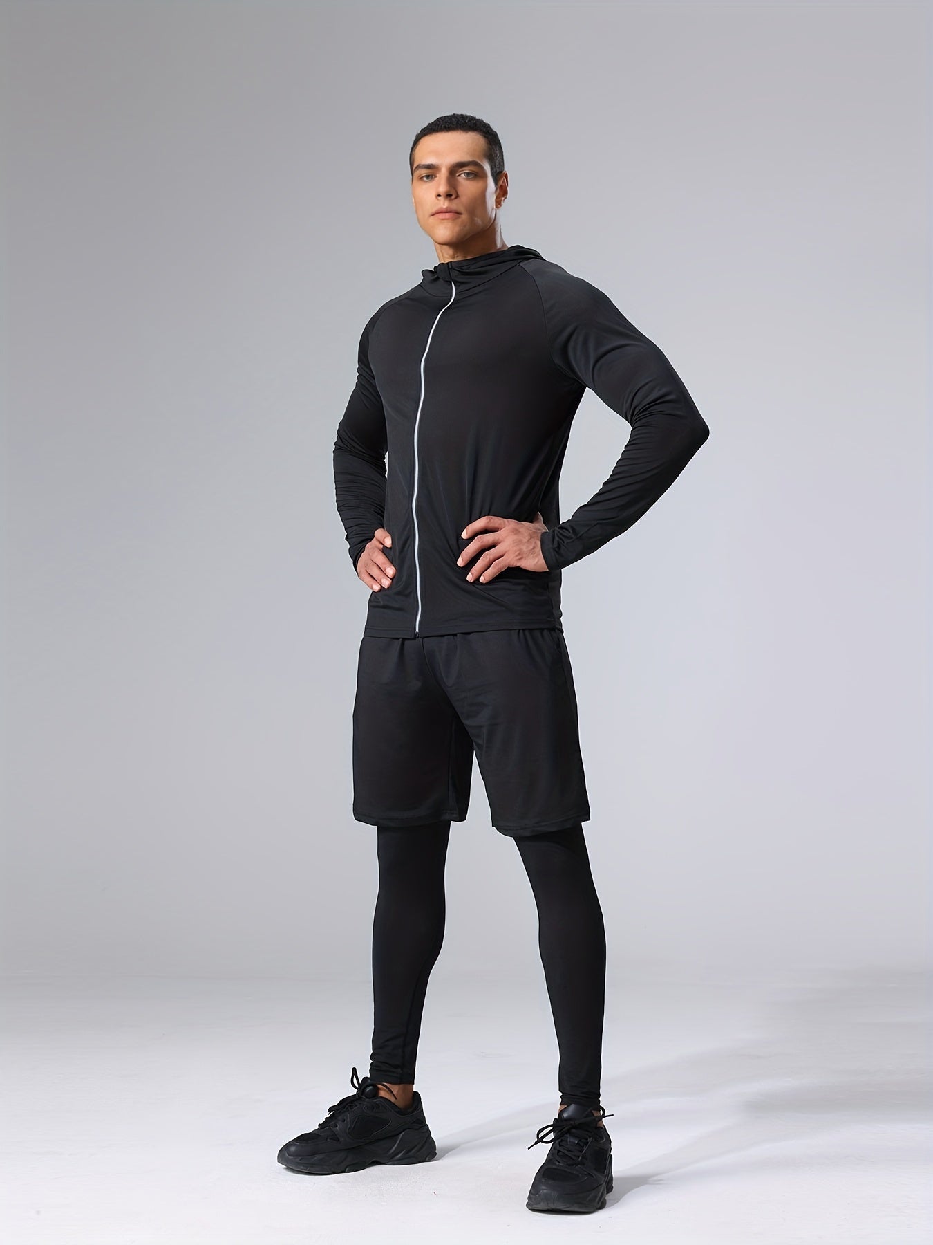 Polyester and elastane blend athletic set includes crew neck hoodie and skinny fit bottoms for running, fitness, cycling, and outdoor activities.