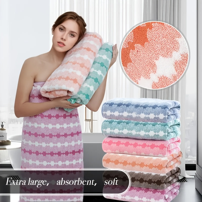 One set of extra large and small bath towels for women made of super soft, absorbent coral velvet with a modern design and strong absorbency.