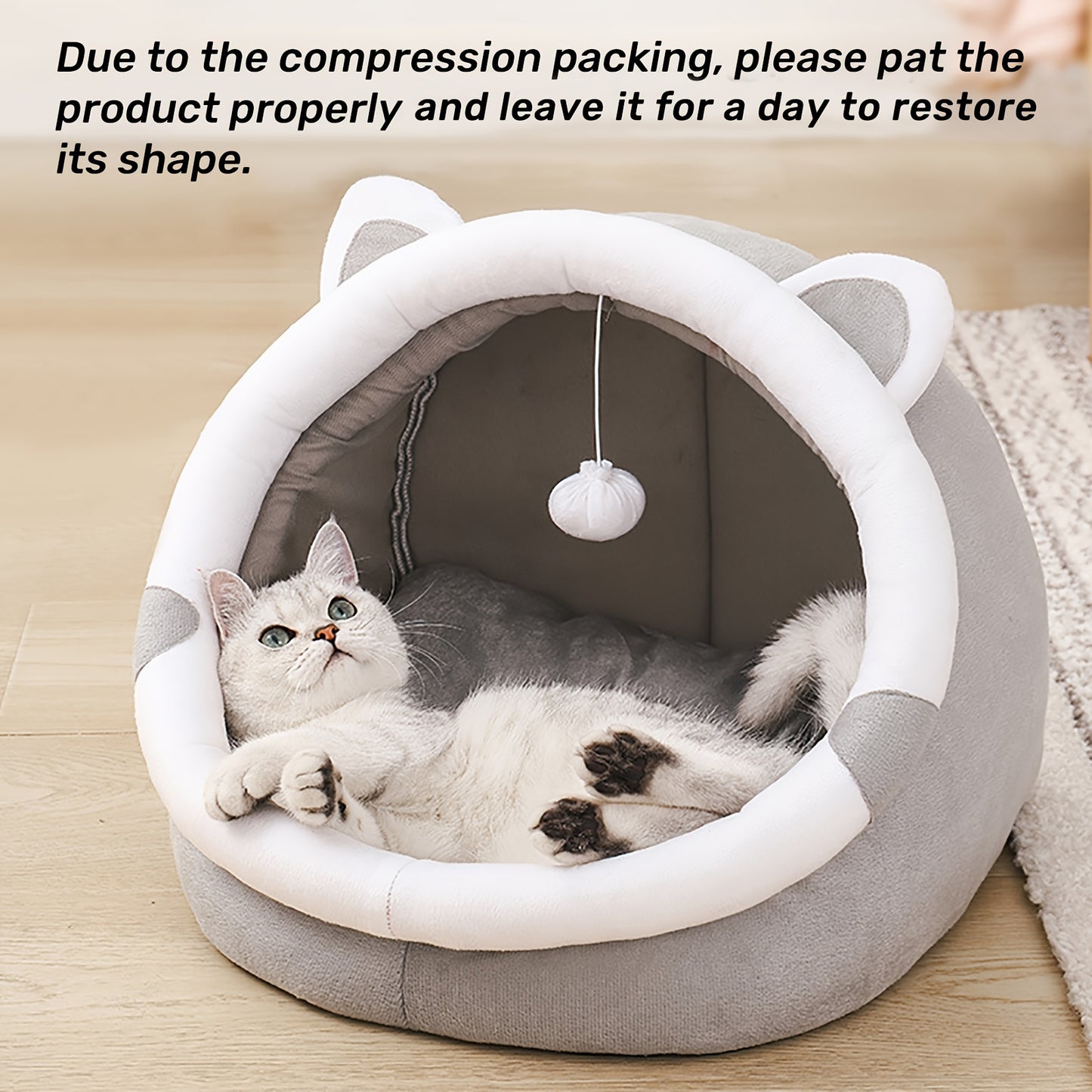 Convertible grey cat ear pet bed made of polyester fiber material. Suitable for small to medium cats and dogs. All-season indoor sleeping lounge with dangling ball toy.