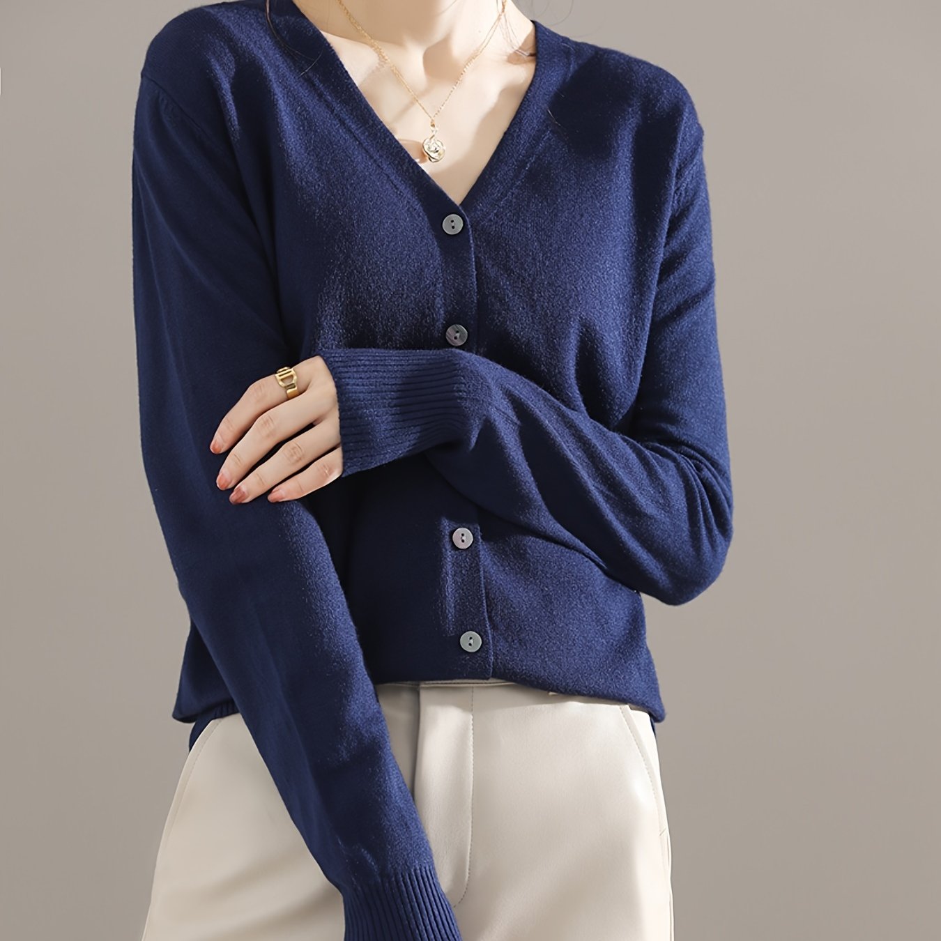 Chic V-neck cardigan with long sleeves, perfect for spring and fall.