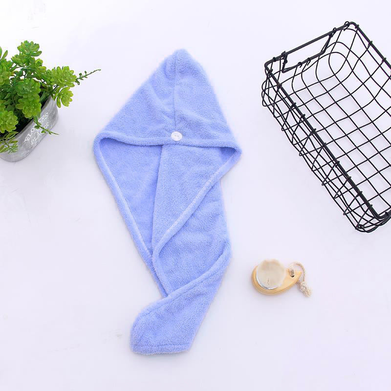 Super absorbent hair towel made of soft and water-absorbing microfiber with anti-frizz and anti-static features, perfect for bathroom use. Made of 100% polyester.