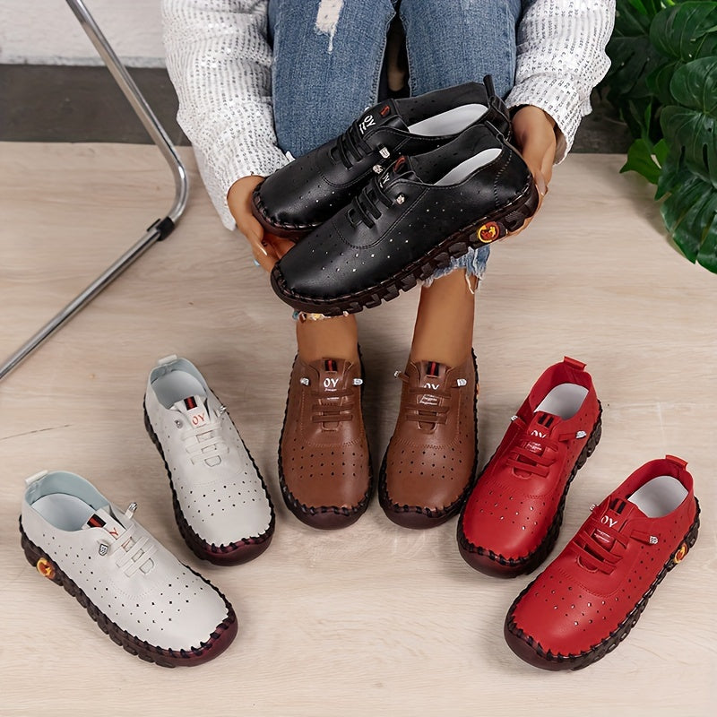 Flat lace-up shoes for women with hollow out design, breathable material, and solid color sneakers for walking.