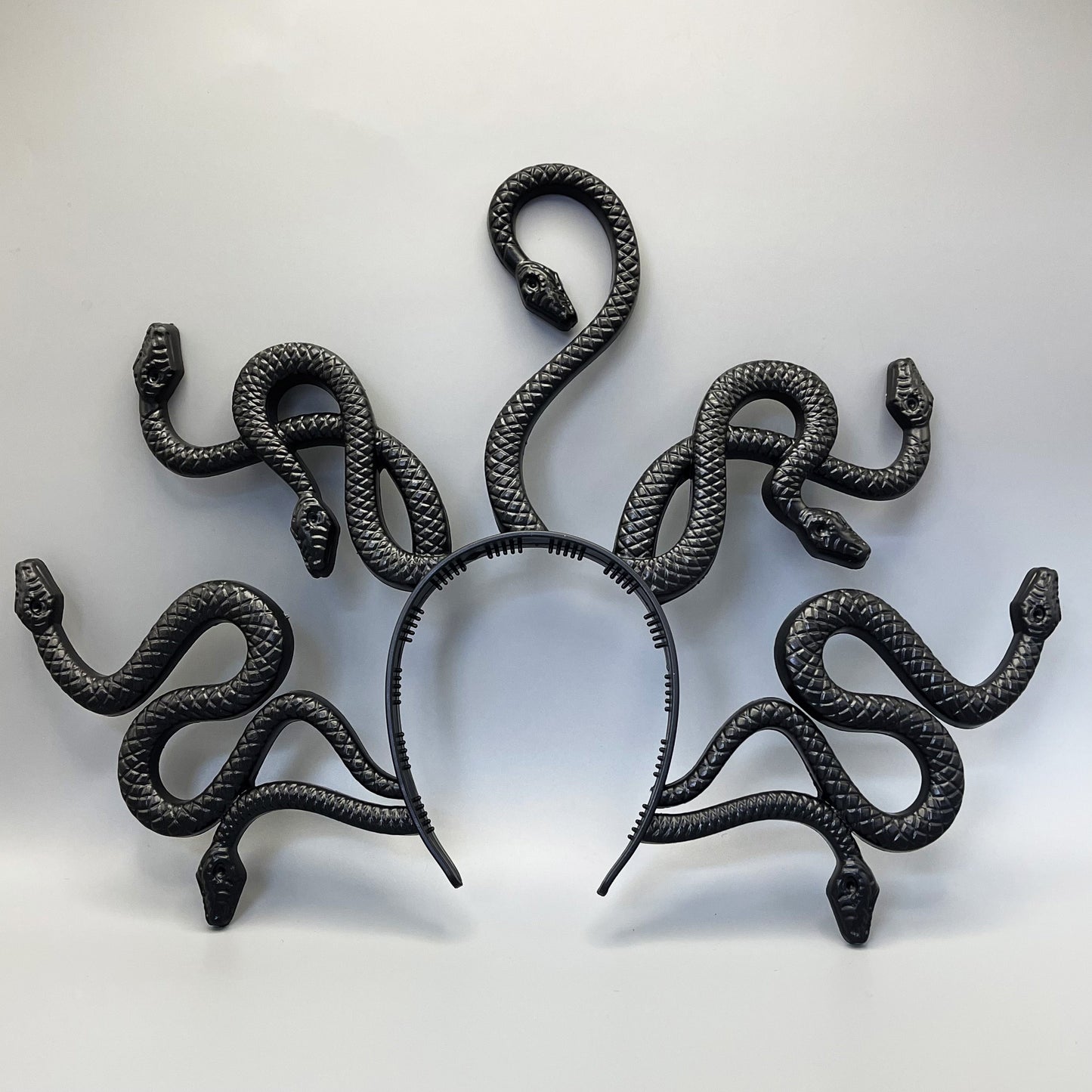 An antique distressed Medusa snake headband perfect for Halloween parties and spooky gatherings, adding a vintage touch to your costume.