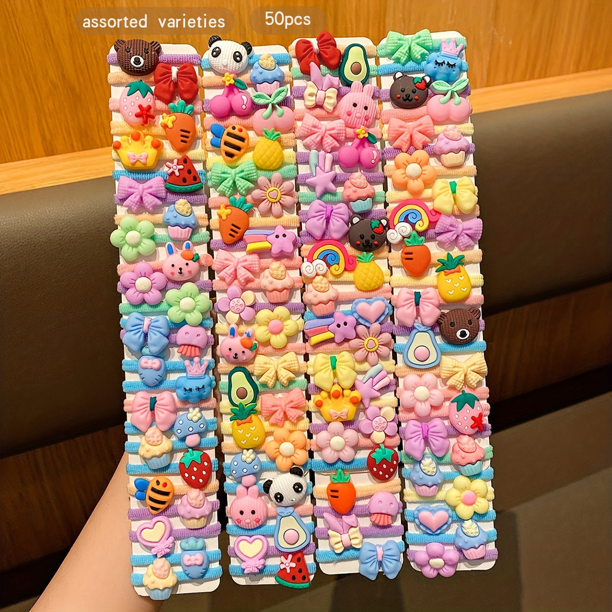 50 cute cartoon styles of randomly assorted rubber bands; sweet and stylish hair accessories for daily use.