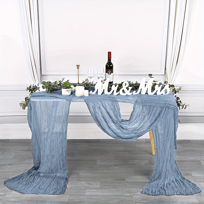 Boho table runner made of pleated polyester gauze, perfect for rustic or wedding decor. Ideal for holiday parties or showers.