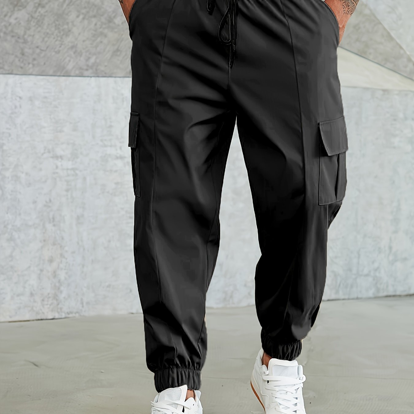 Solid cargo pants for plus size men, ideal for sports and outdoor activities.