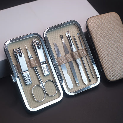 Manicure and pedicure set with nail clippers, files, ear spoon, and portable case for nail care at home or on-the-go.