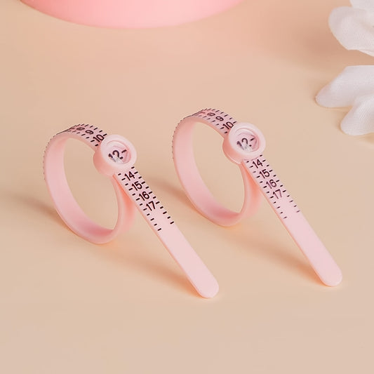 Ring sizer tool for measuring finger size, reusable and in pink, measures sizes 1-17 USA.