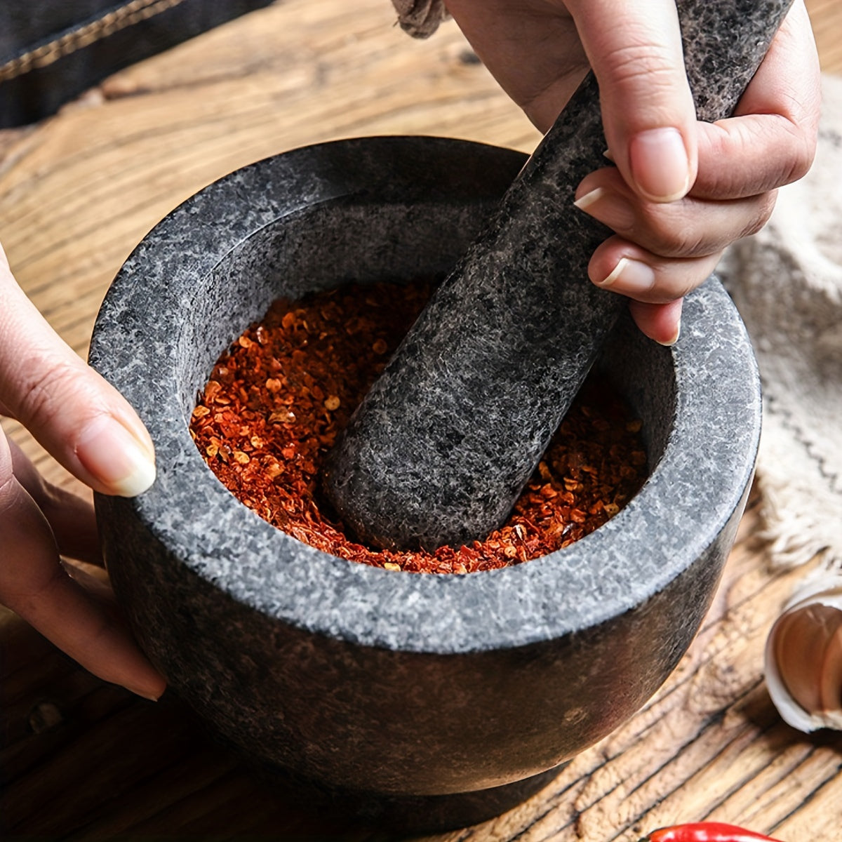 One piece of natural stone bowl designed for use in kitchens. This polished molcajete is perfect for grinding garlic, spices, and herbs. It can also be used as a traditional garlic crusher, grain and seed mill.