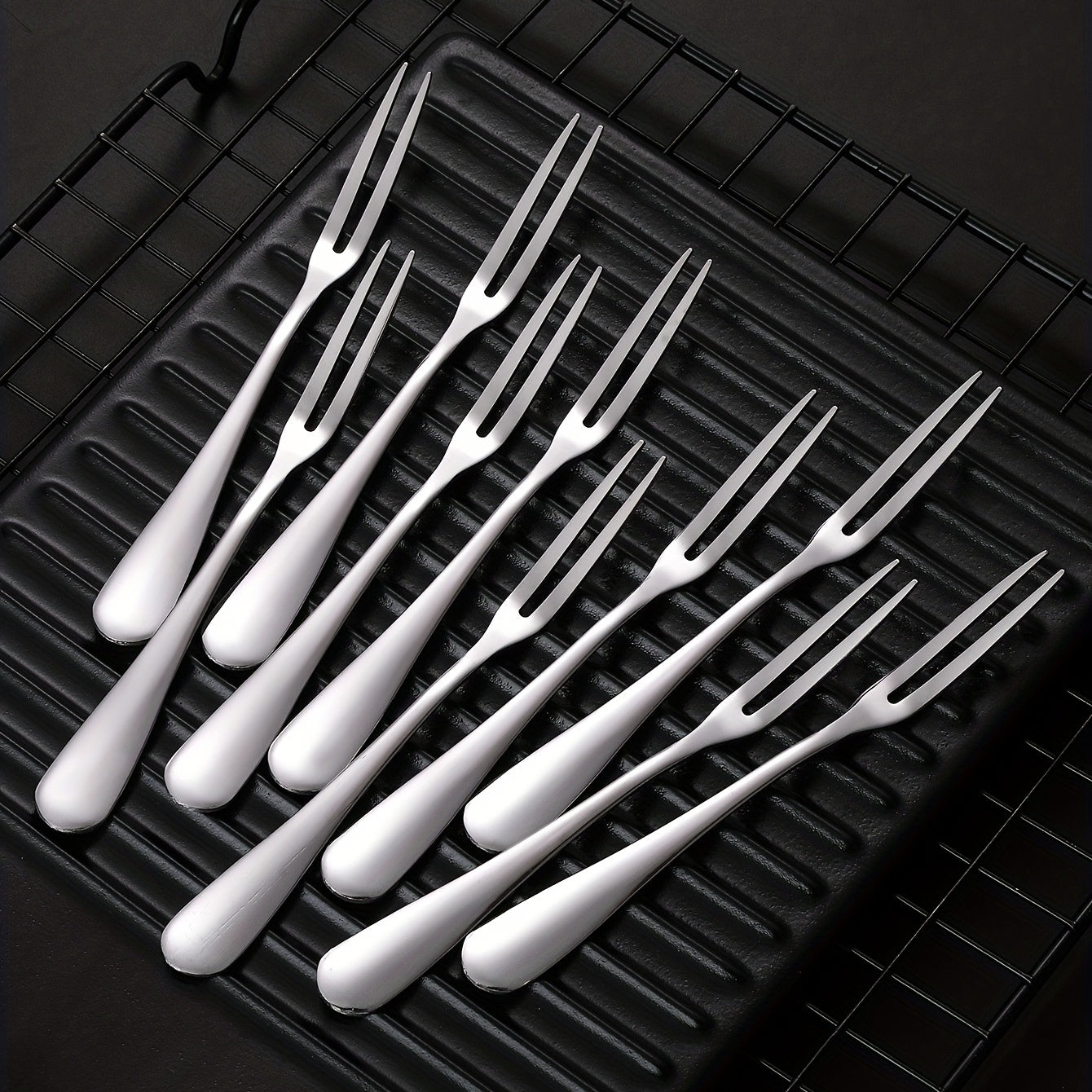 10 stainless steel fruit forks for multiple kitchen uses.