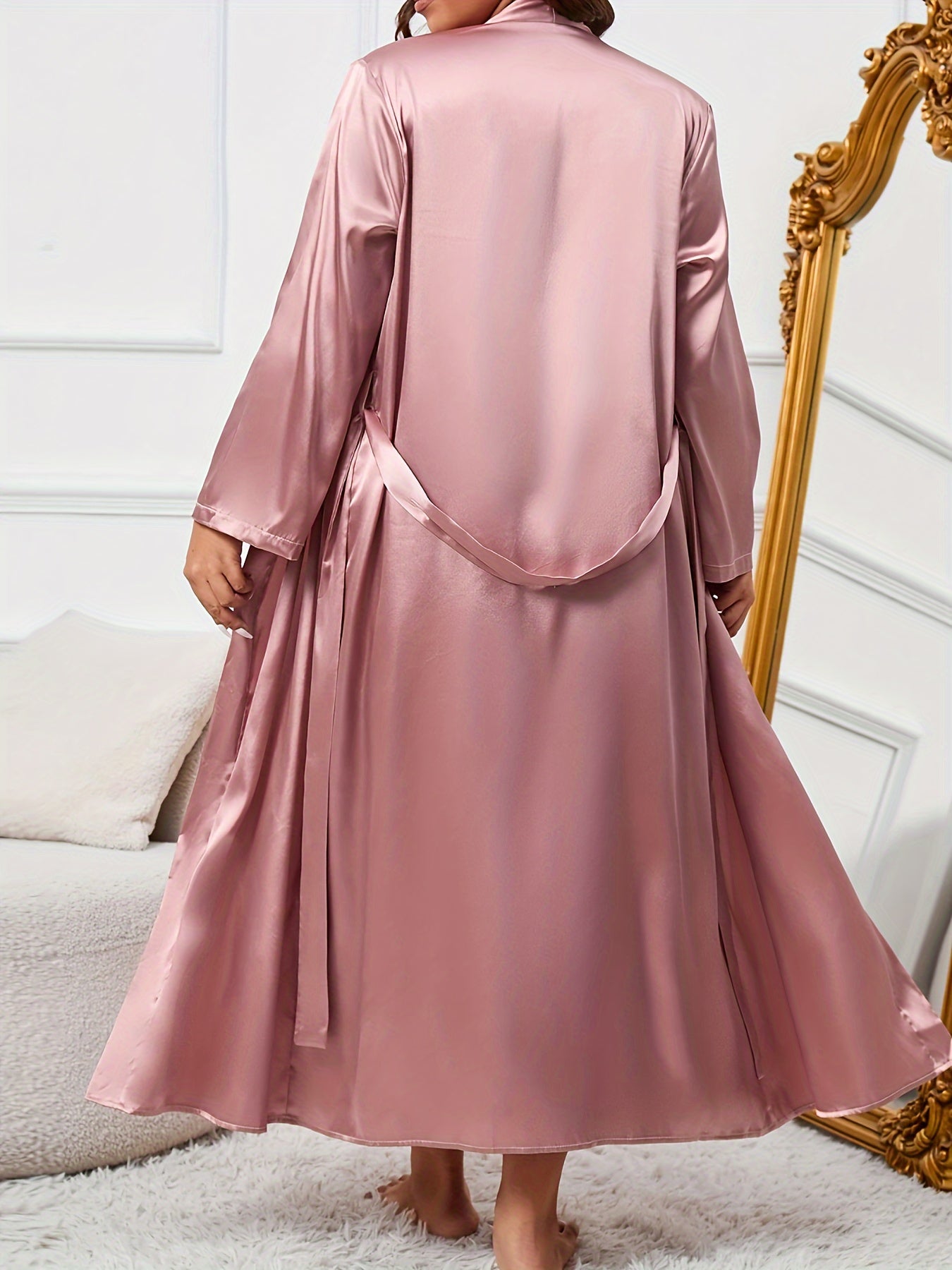 Elegant satin pajama set for plus size women, including slip dress and robe with belt. Perfect for fall and winter.