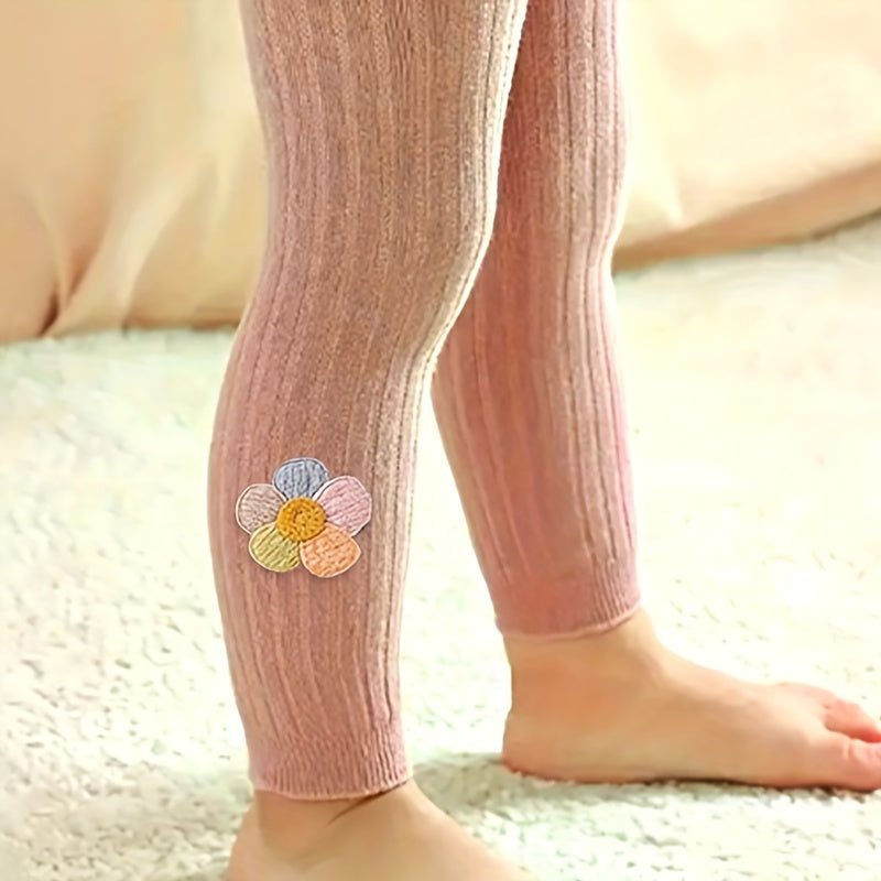 Girls slim legging pants with rib knit flower doll design, made of cotton blend stretch fabric for a tight fit.