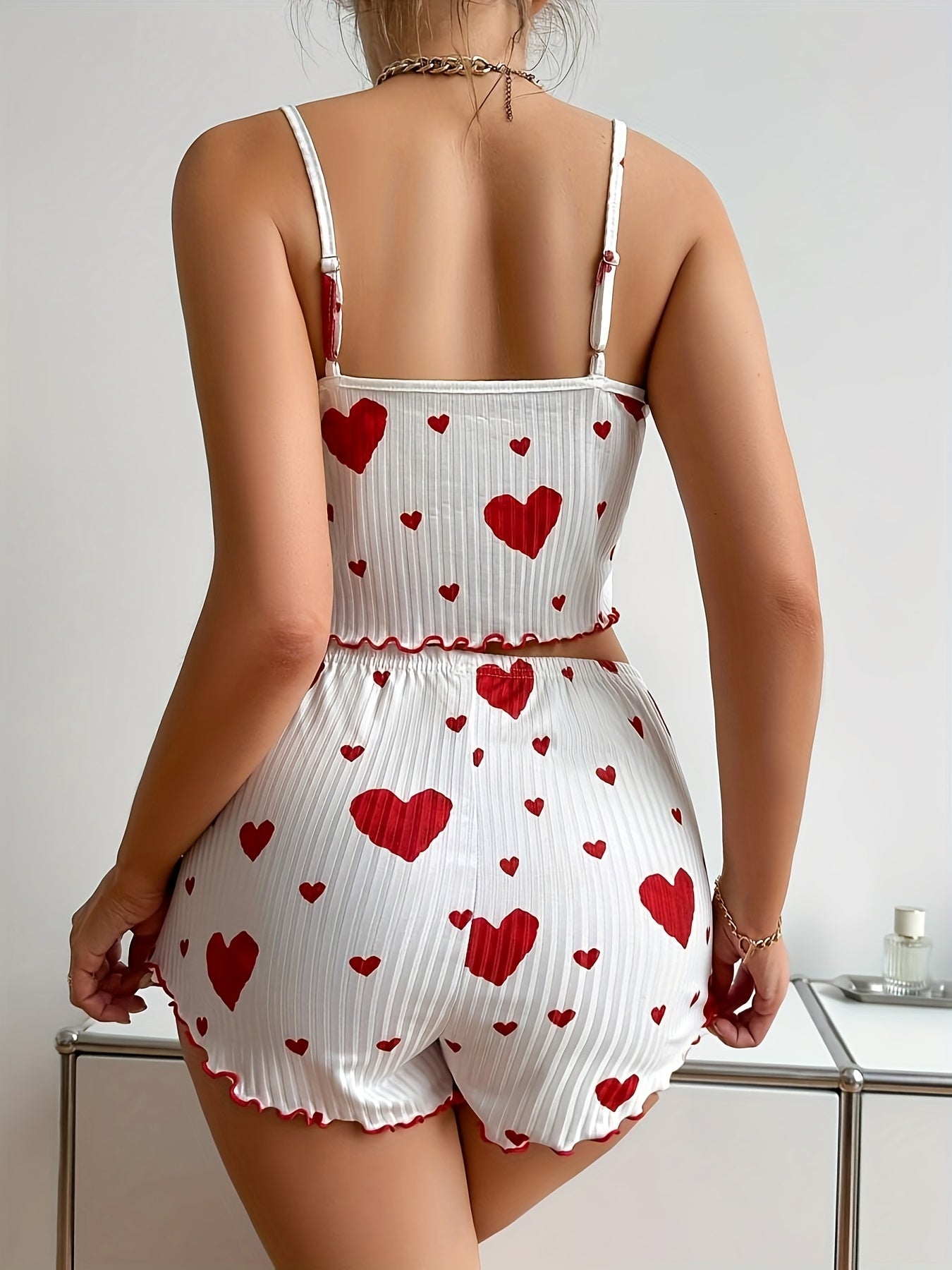 Polyester pajama set with heart print and bow detail - comfortable knit fabric for adults.