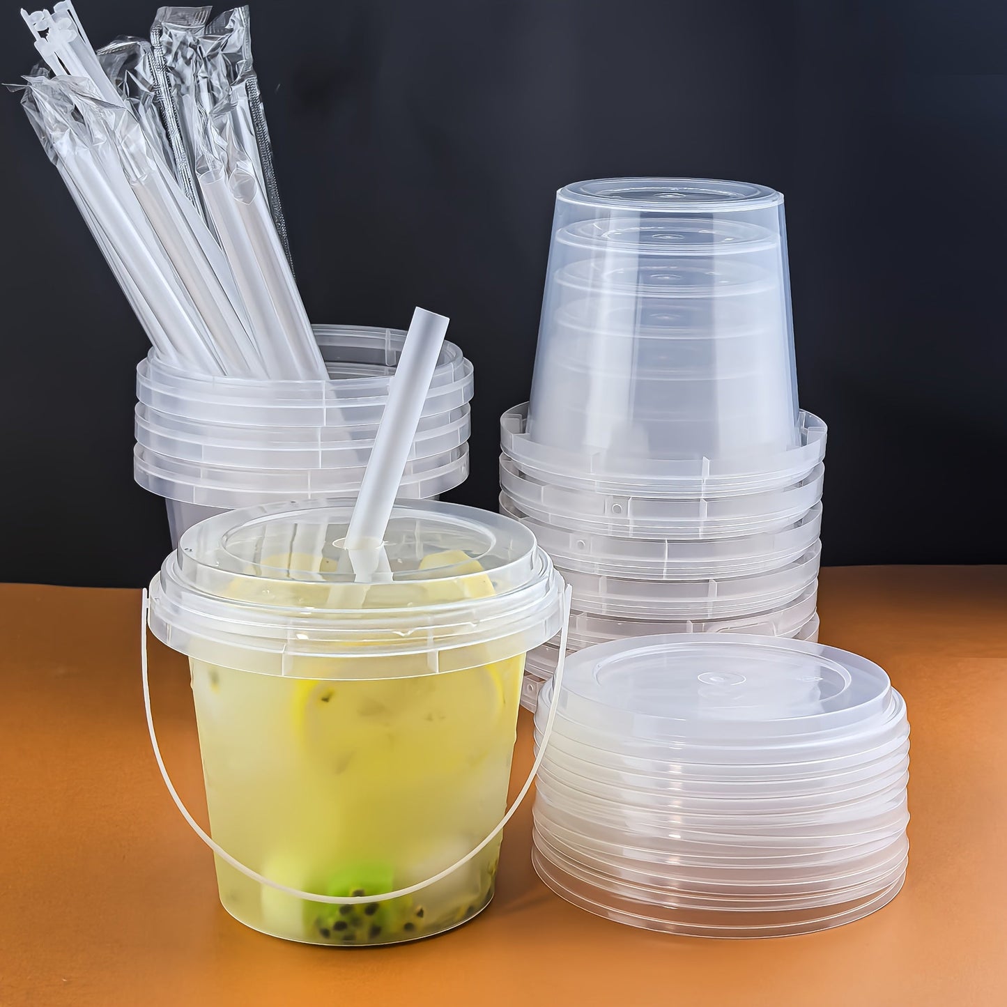 10 reusable plastic cups with lids and straws, each holding 700ml - perfect for juice, iced drinks, and summer refreshments. BPA-free, leakproof, and portable for outdoor activities, sports, and more. Made from high-quality, recyclable material.