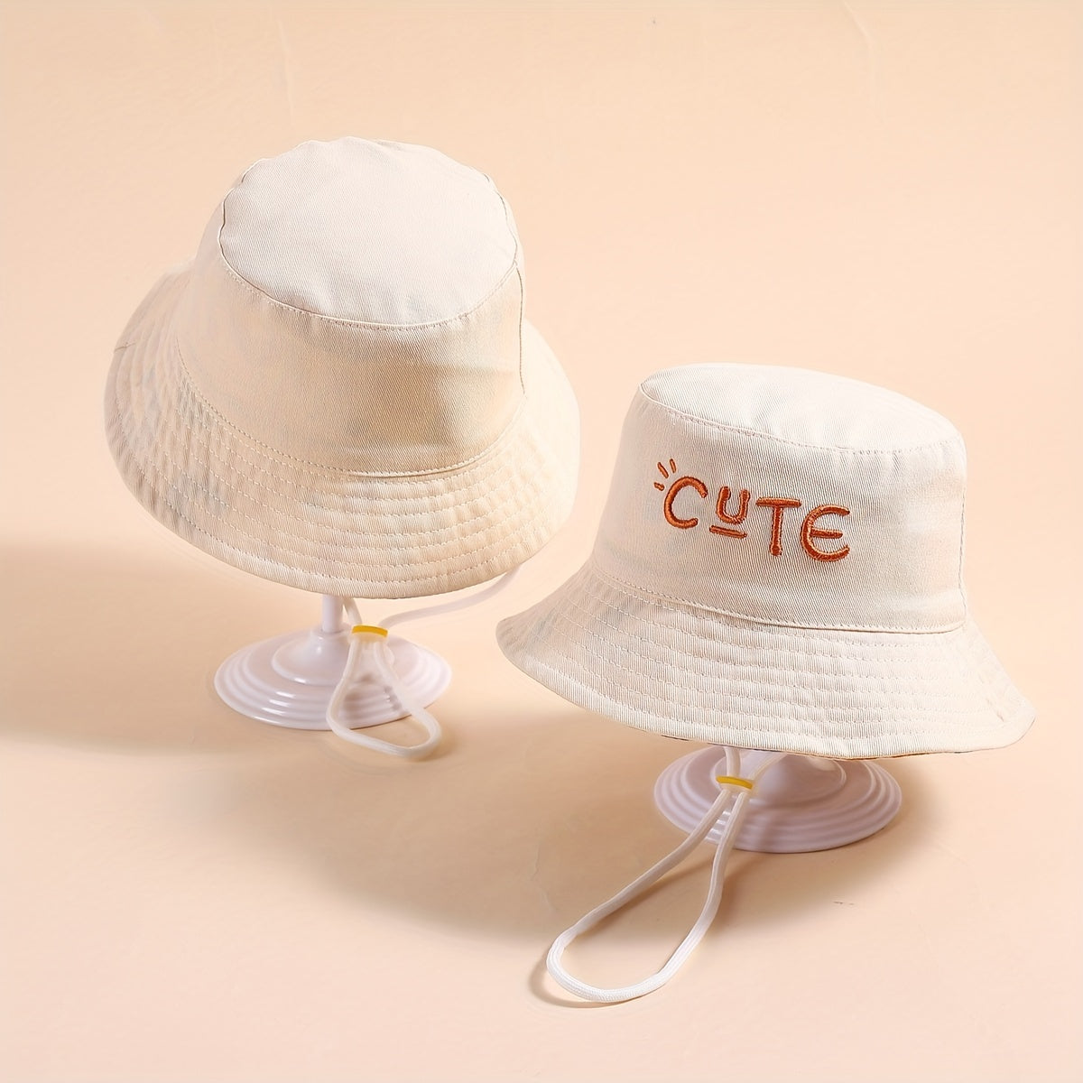 Stylish fisherman hat with cute letter embroidery, wide brim and drawstrings for sun protection and outdoor activities. Ideal for boys and girls in beach parties or traveling.