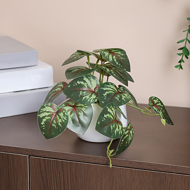 Artificial green leaf plant for home, office, or shelves décor.