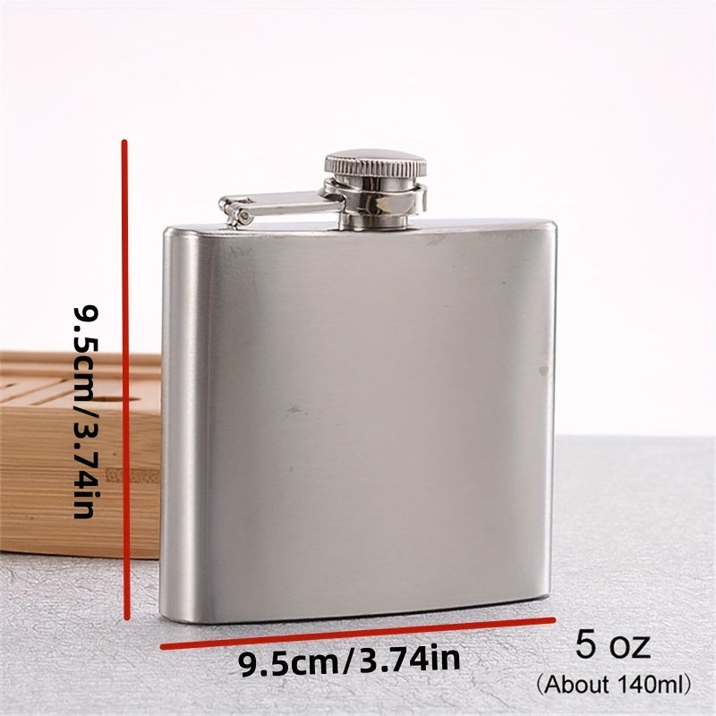 Portable stainless steel hip flask for alcohol, with screw cap and pocket-sized design for outdoor use.