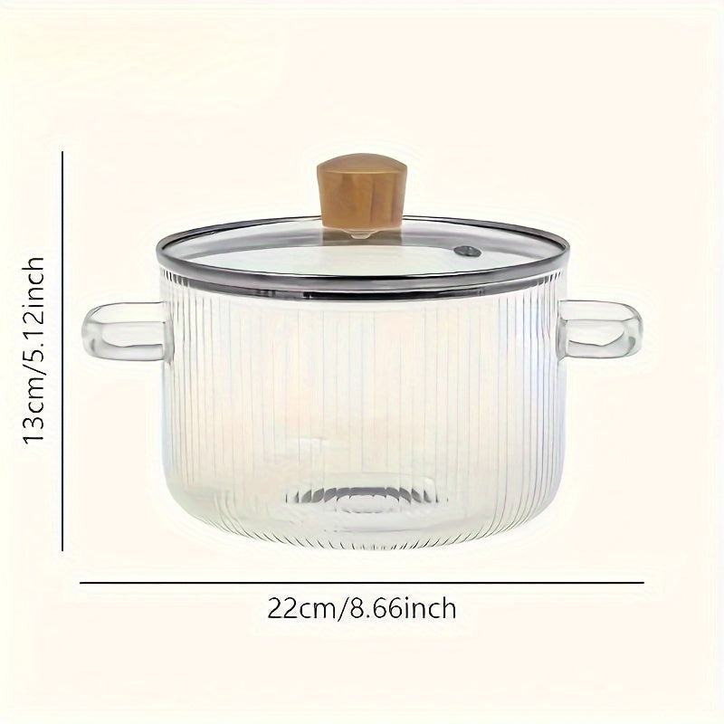 Glass cooking pot with a lid, perfect for stove top cooking. Made from heat-resistant borosilicate glass, this 1.6 liter (54 oz) pot is ideal for simmering soups, heating milk, and preparing food supplements. A versatile addition to any kitchen, this