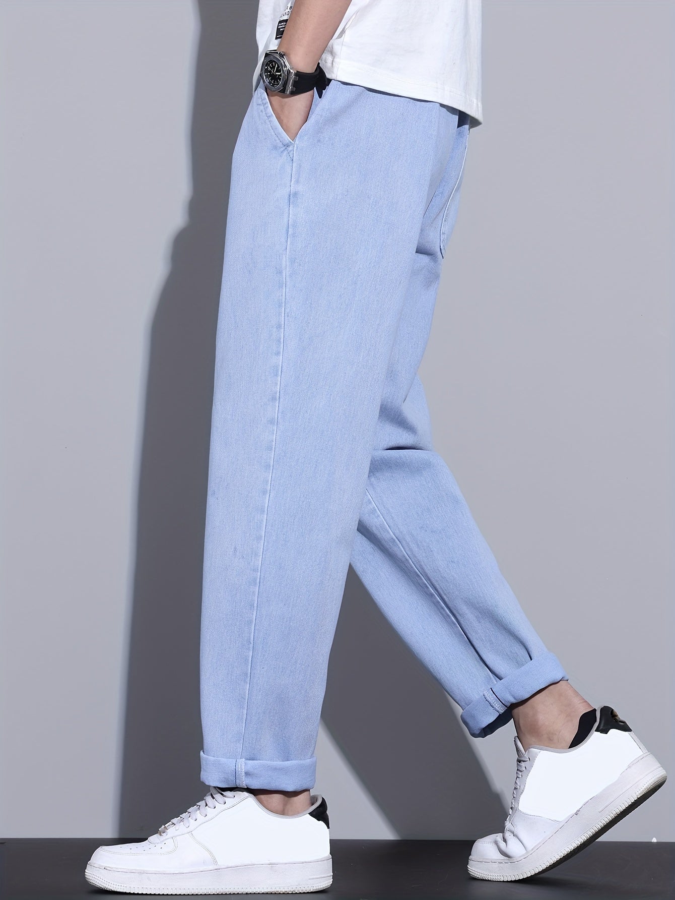 Men's light blue drawstring waist straight-leg jeans in glossy fabric, perfect for all seasons.