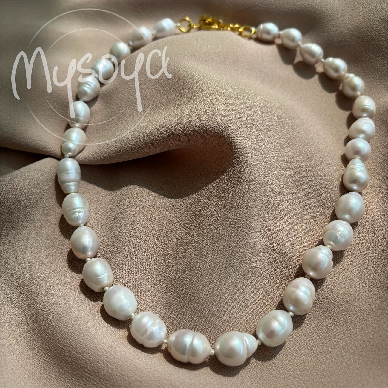 Exquisite handcrafted baroque pearl necklace featuring 10-12mm natural freshwater pearls. This stunning piece of jewelry comes beautifully packaged in a gift box, making it the perfect accessory for both daily wear and special occasions.