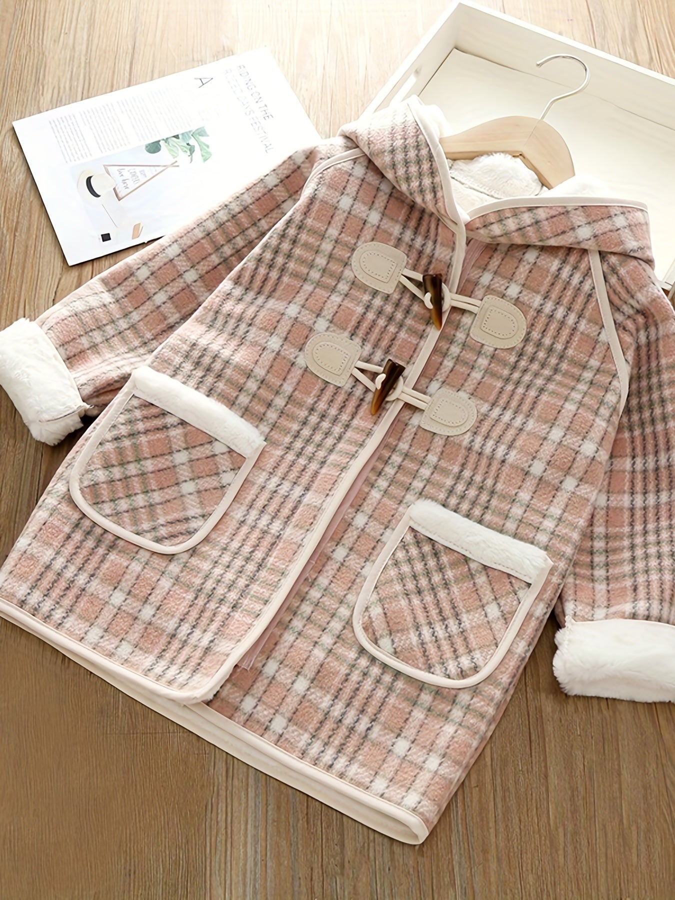 Girls' winter fleece plaid toggle coat with hood and pockets for a stylish outdoor look.