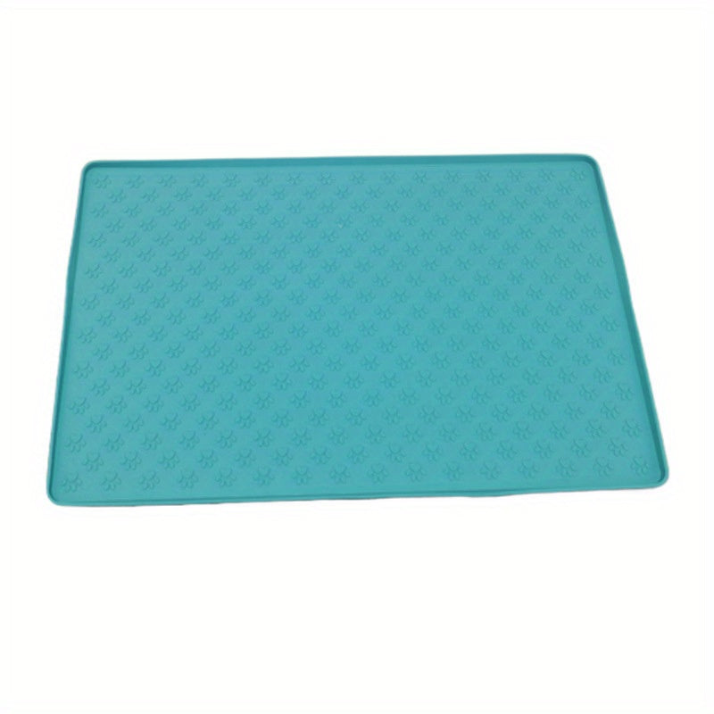 Silicone pet food mat with raised edge.