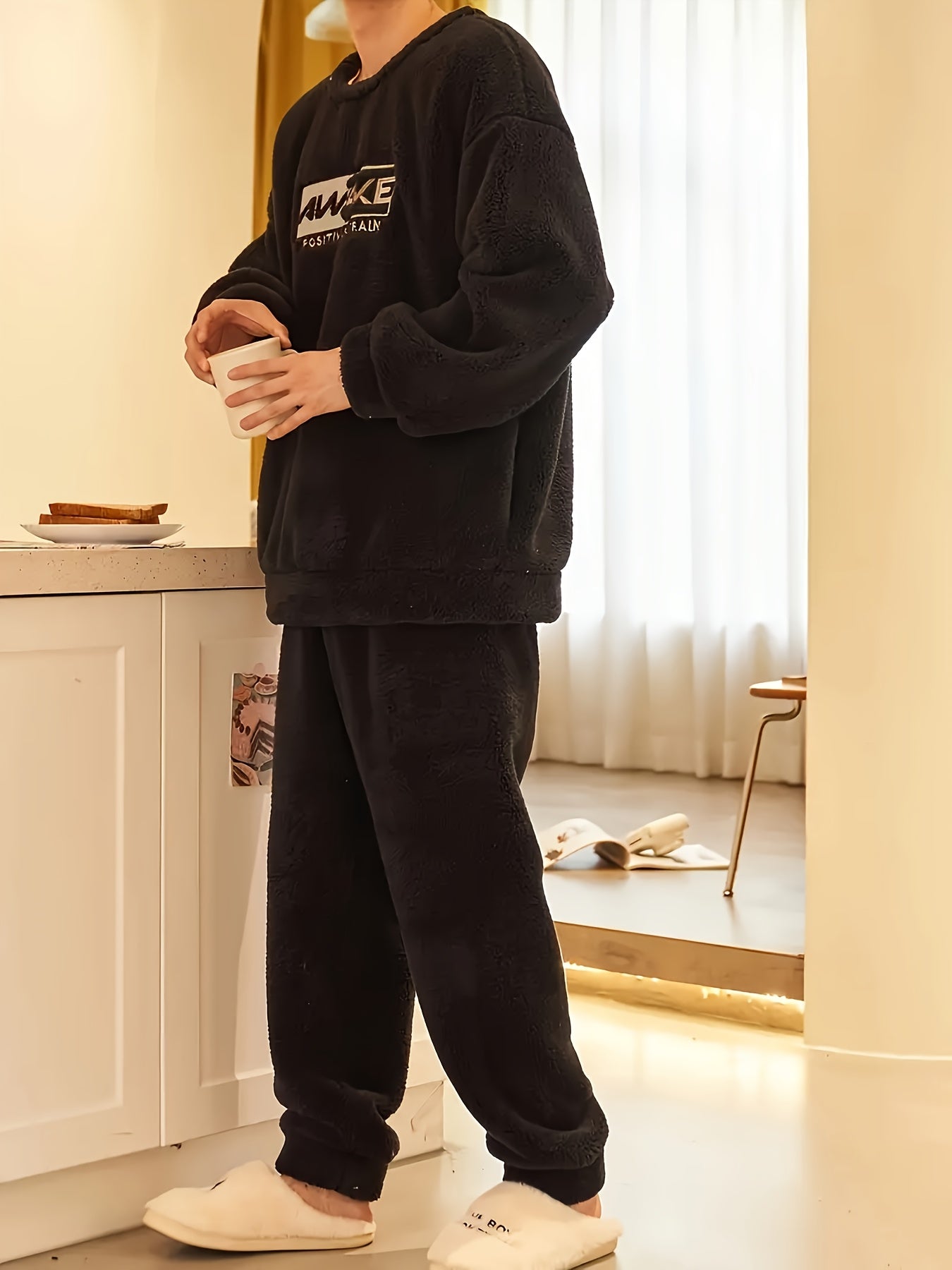 Comfy fleece pajama set for men with long sleeve top and loose-fit pants, perfect for fall/winter lounging.