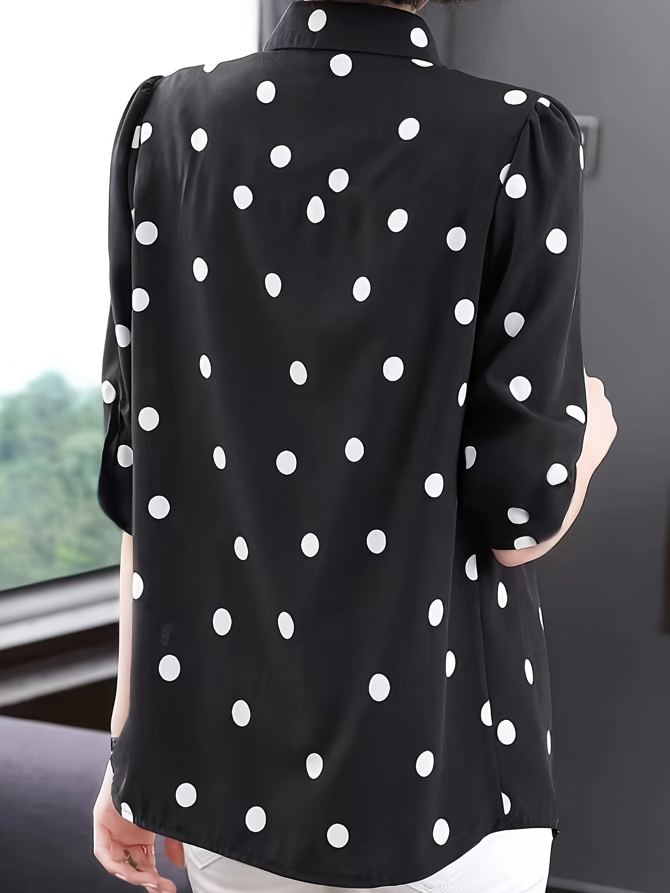 Stylish polka dot blouse for women - perfect for summer vacations. Made of polyester and machine washable with button detail. Non-stretch fabric.