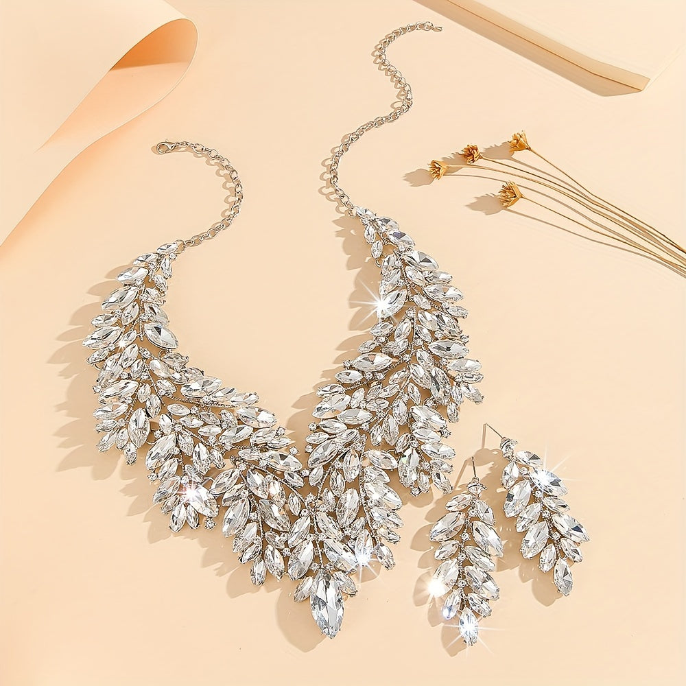 Luxurious wedding jewelry set crafted with fine materials and adorned with shimmering artificial crystals. This exquisite 3-piece set includes a necklace and earrings, perfect for weddings and special events. A timeless gift for any occasion, making it