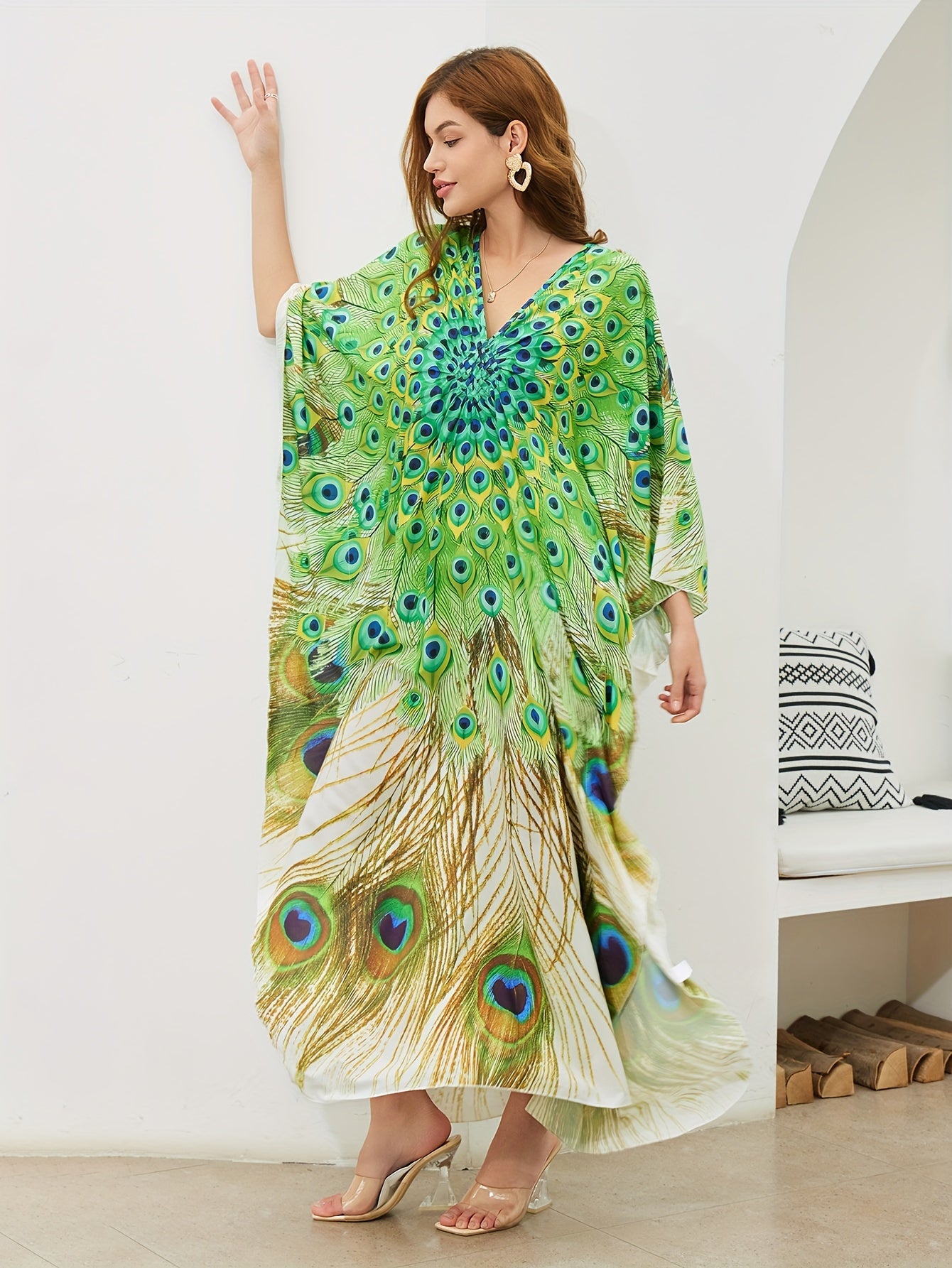 Handmade V-neck maxi beach dress in vibrant green, yellow, and blue peacock print, perfect cover-up for swimwear.