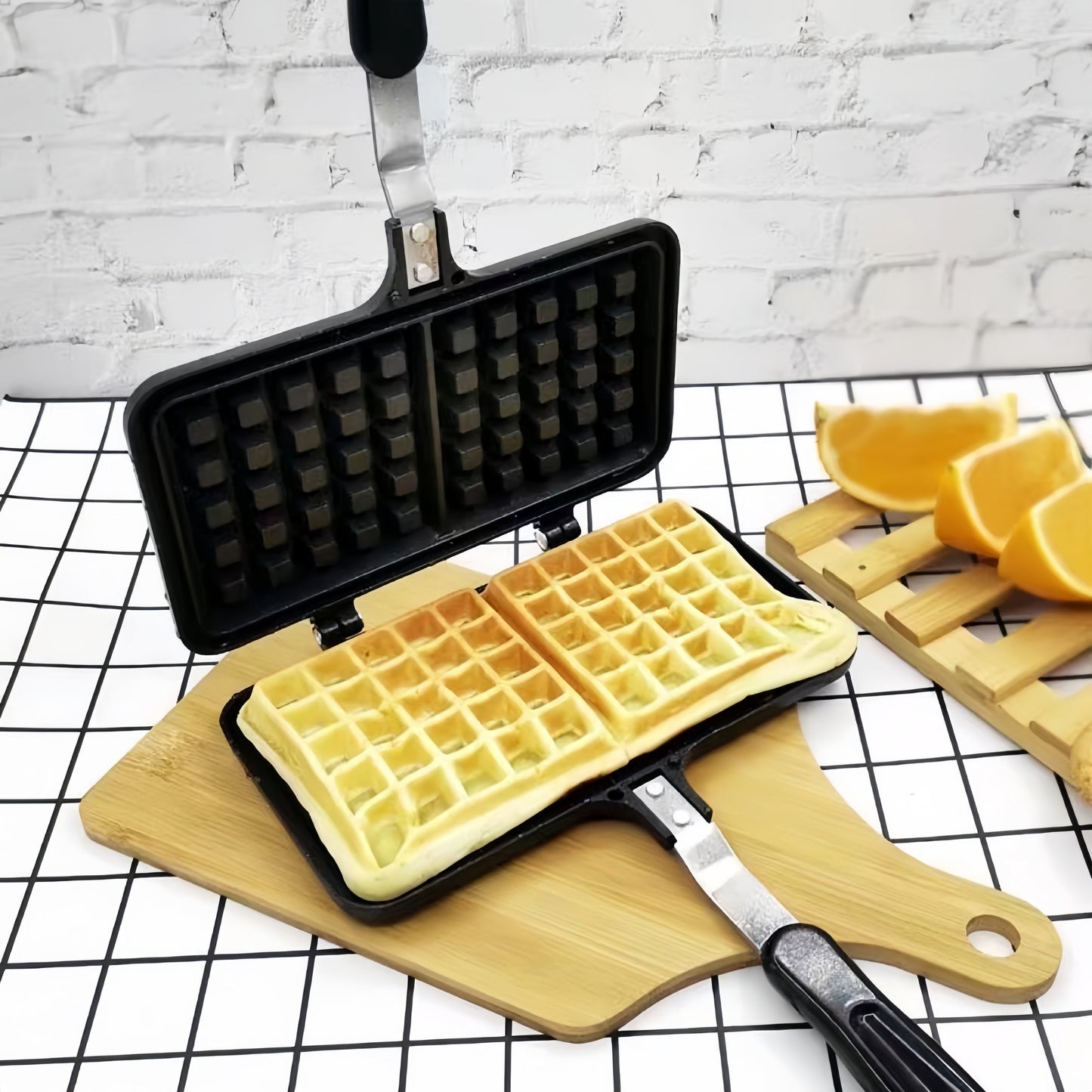 Get ready to make delicious double-sided waffles at home with this durable aluminum alloy waffle maker featuring non-stick plates and a long handle for easy flipping.