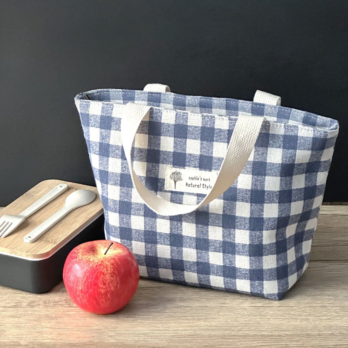 Stay organized and stylish with our plaid insulated lunch bag, made from durable materials to keep your items safe and secure. Available in classic color combinations of black and white, blue and white, and green and white, this lunch bag is versatile