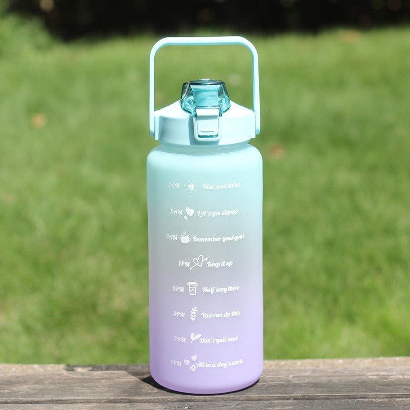 Gradient sports water bottle with 2L capacity, straw and handle, PVC free, lockable lid for climbing and outdoor activities.