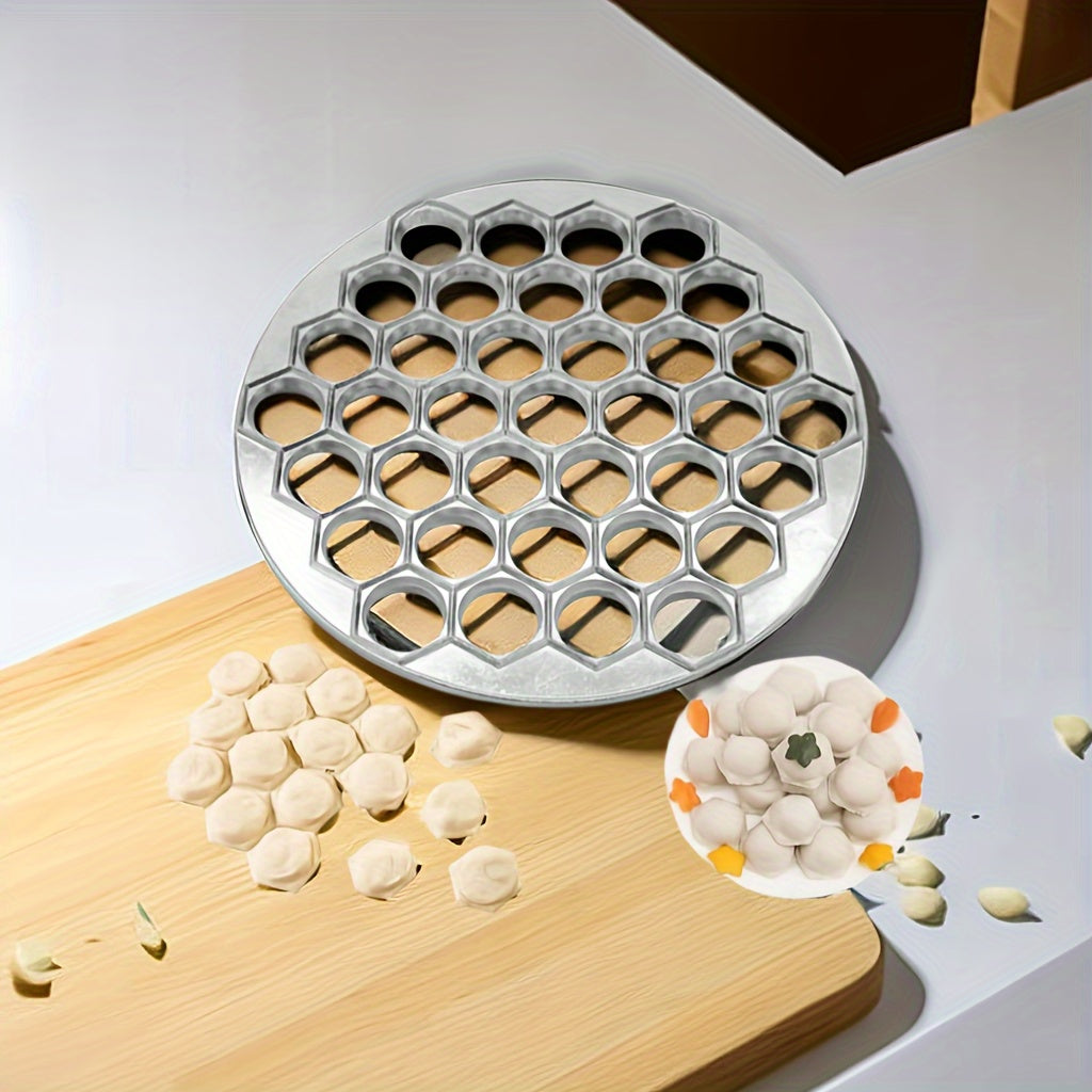 Collection of handy kitchen gadgets comprising of a dumpling maker, dumpling cutter, golden aluminum dumpling mold, tray dumpling cooking mold, and portable outdoor camping tool for effortless transport and convenience during use.