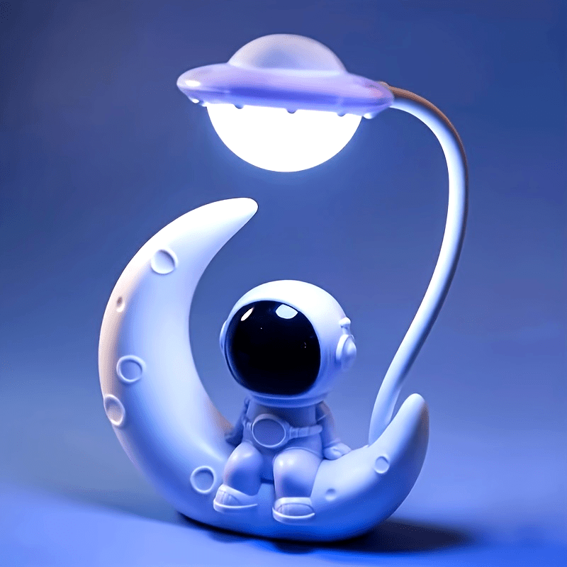 Illuminate your bedroom with the Astronaut Moon LED Nightlight - USB Powered Desk Lamp. This adjustable brightness lamp is the perfect addition to your bedroom decor and makes a great Christmas gift.