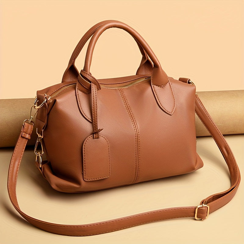 Boston style synthetic leather tote bag with zipper closure, polyester lining, and edge paint detail. Comes in Black, Pink, Khaki, Orange, and Light Brown.