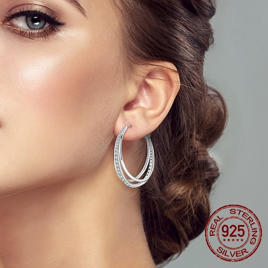 A pair of beautiful Sterling Silver 925 earrings with three hoops, adorned with luxurious zirconia for an elegant and delicate look, perfect for women.