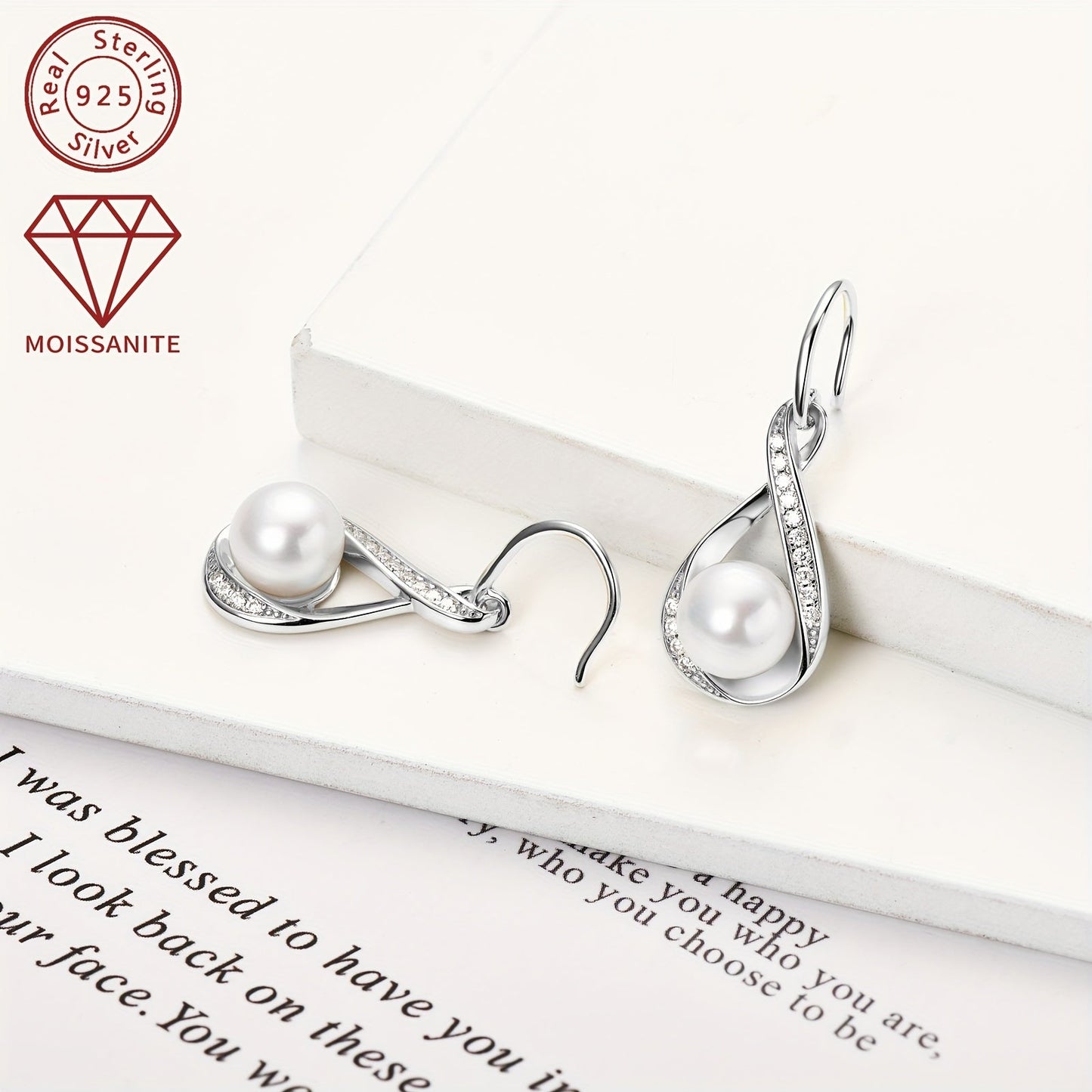 Pair of pearl earrings featuring natural freshwater bread beads measuring 8mm and adorned with 28 pieces of 1.2mm moissanite stones, totaling 0.224 carats. Crafted in 925 silver, these earrings boast a silvery gram weight of 3.7g. The design showcases a