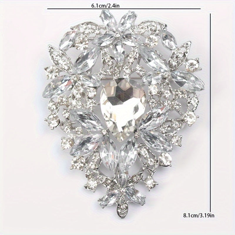 Bu ajoyib Rhinestone Brooch Pin bilan vintage nafislikni qo'shing, u notekis shakldagi katta kristal shisha dizayniga ega. Kiyimlarni bezatish va moda ansamblingizga hashamatli bir tuyg'u qo'shish uchun mukammal.