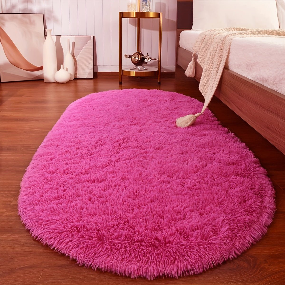 Soft and fluffy oval shaggy area rug, perfect for bedroom or living room. Made with skin-friendly thickened sponge and tufted polyester material. Durable and easy to maintain. Adds decorative touch to indoor spaces such as sofa, bedside, playroom, or