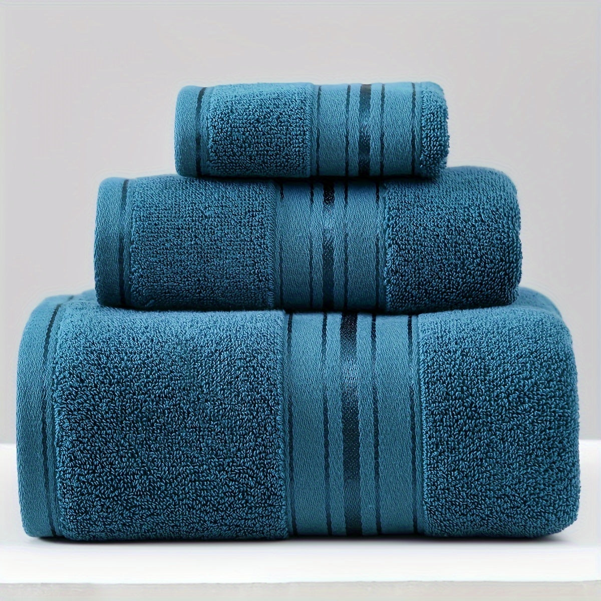 3-piece cotton towel set includes a washcloth, hand towel, and bath towel. Absorbent, quick-drying, super soft, and skin-friendly. Ideal for home bathroom use.