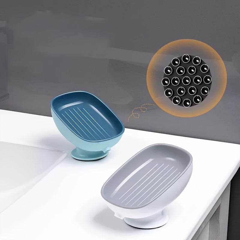 Suction cup soap dish with drainage for bathroom and kitchen sink storage.