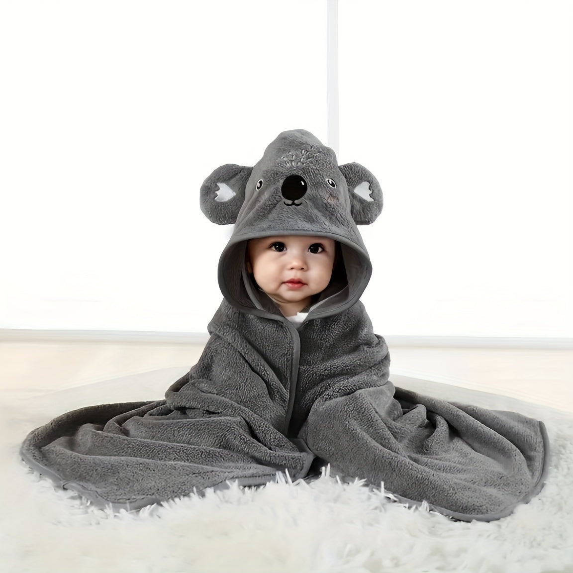 Soft and cozy CuddleSoft Bath Towel Wrap featuring a cute cartoon design. This multifunctional hooded towel is made of super soft polyester and quick-dry knit fabric, providing a comfortable experience for both adults and kids. Perfect for use in the