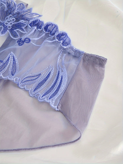 Women's light purple lace mesh panties with floral embroidery feature an open crotch and breathable, sheer design made from a nylon and elastane blend that is hand washable.