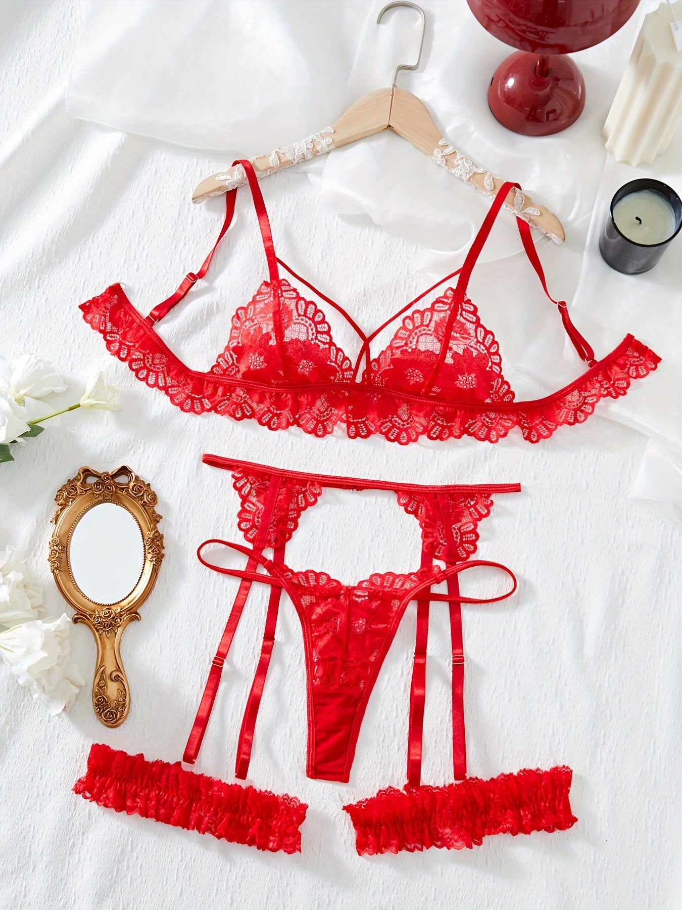 Floral lace lingerie set includes bra, thong, garter belt. Subtly sexy intimates for women.