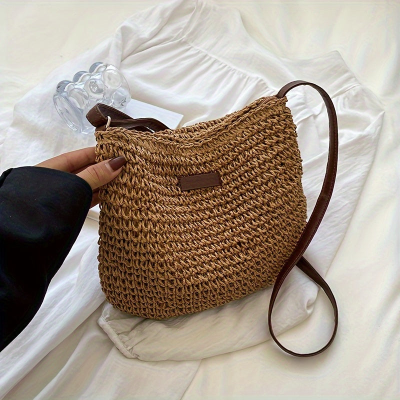 Handmade rattan crossbody bag for women, woven straw shoulder bag for summer.