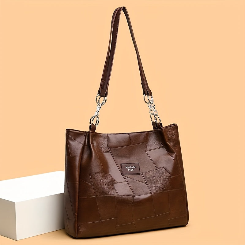 Stylish quilted tote bag with zipper, fixed strap, and classic design, perfect for work or everyday use. Comes in black, white, or brown.